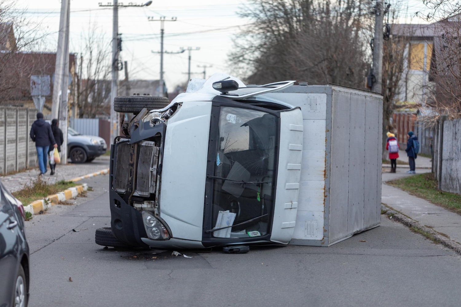 Crash involving a garbage truck in a residential area, highlighting the risks of waste collection vehicle accidents and the importance of legal support.